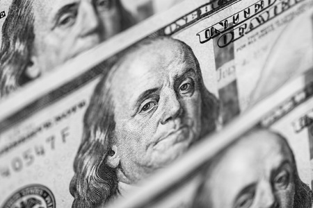 Hundred dollars bills standing in a rowの写真素材