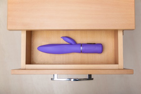 Sex toy in open countering bedside tableの写真素材
