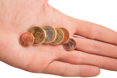 handful of euro coins in handの写真素材