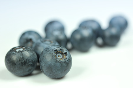 Group of fresh juicy blueberries isolated on white backgroundの写真素材