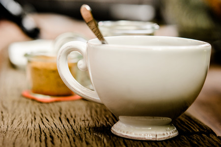 cup of black coffee, white and brown sugar on the wooden table backgroundの写真素材