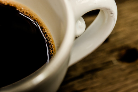 cup of coffee on the wooden table background, still lightの写真素材