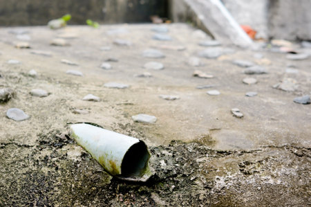 drainpipe in cement ground for waste of water around houseの写真素材