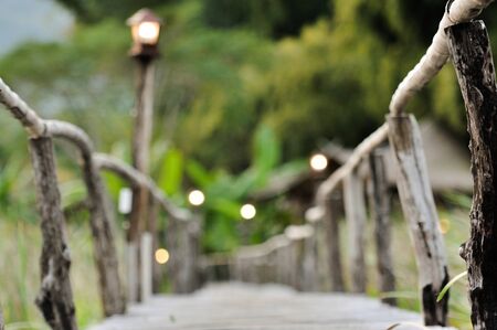 wood walk way in nature, landscape of pond and mountain backgroundの写真素材
