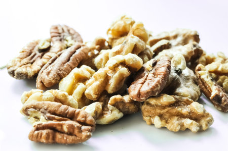 Healthy mixed nuts - walnut and pecan with rosemaryの写真素材