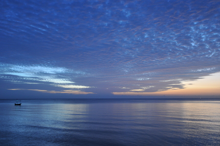 beautiful blue sky with clouds background.Sky clouds and sea, Sky with clouds weather nature cloud blue, Sky background on sunset, sunset at sea. variety of colors and hues of the rising sunの写真素材