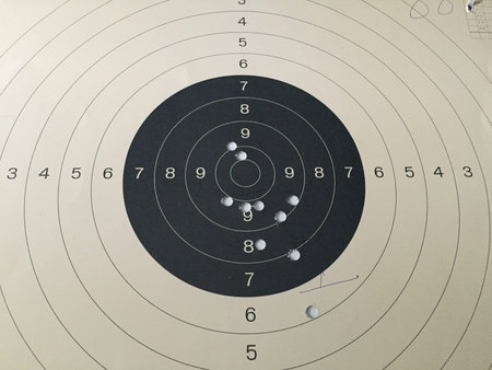 Bull eye target with bullet hole