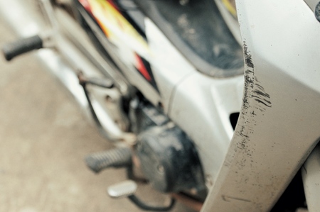 Scrawl on part of motorcycle after got the accidentの写真素材