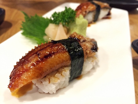 Traditional Japanese food, Eel (unagi) Nigiri Sushi or Unagi Kabayaki on wooden backgroundのeditorial素材