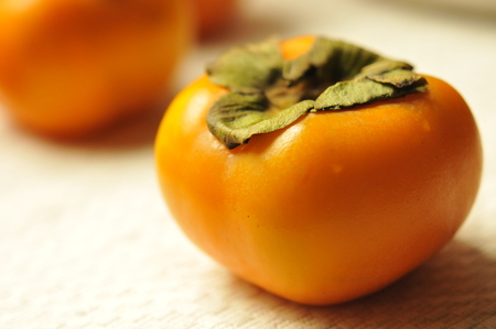 Fresh Persimmon fruit, fruit background, fruit conceptualの写真素材