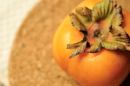 Fresh Persimmon fruit on the white tableの写真素材
