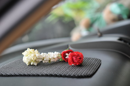 Jasmine garland on the car console, it's means faith and believe for safety and protect when you driveの写真素材