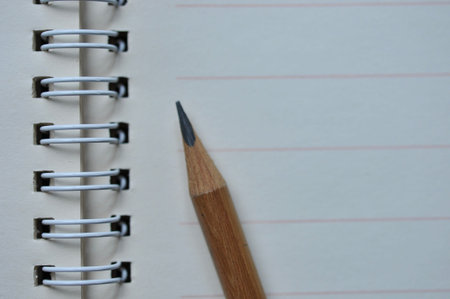 abstract background of close up pencil on notebookの写真素材