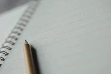 abstract background of close up pencil on notebookの写真素材