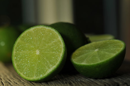 lime slices on wooden table. Detox diet, limes Backgrounds, Close up shot, fruit macro photography