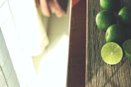 lime slices on wooden table. Detox diet, limes Backgrounds, Close up shot, fruit macro photography