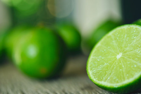 lime slices on wooden table. Detox diet, limes Backgrounds, Close up shot, fruit macro photography