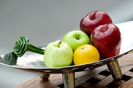 Thai exotic tropical fruits in luxury silver basket, welcome fruit basket in hotelの写真素材