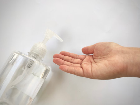 Pumping alcohol gel 70% to Hand apply from clear plastic bottle in Sanitation, anti germ and...