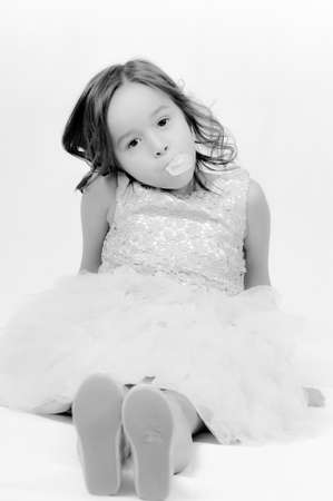 Portrait of happy pretty curly little girl posing over white background , girl smiling , happy feelingの写真素材