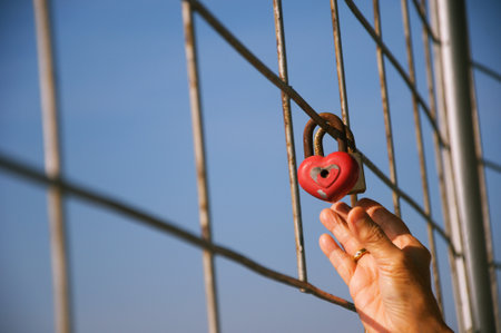 love padlock locked on reinforced steel on high building ., in winter time, Valentines Day card conceptの写真素材