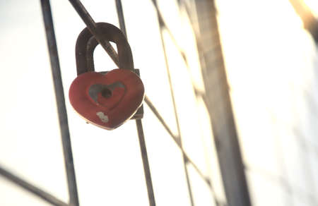love padlock locked on reinforced steel on high building ., in winter time, Valentines Day card conceptの写真素材