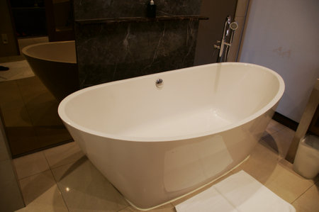 Close up of white bathtub in bathroom. Bathroom interior.の写真素材