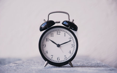 Retro alarm clock on white background. Time to wake up.の写真素材