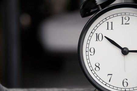 Close-up of a clock showing 12 o'clock in the morningの写真素材