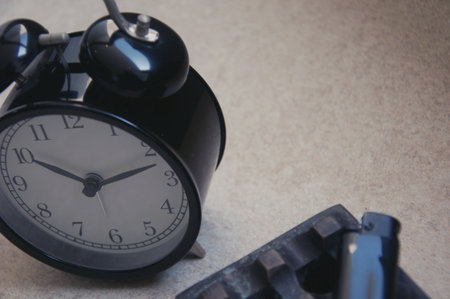 Black alarm clock on the table. The concept of time management.の写真素材