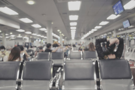 Blurred image of passenger waiting for boarding at the airport terminal.の写真素材