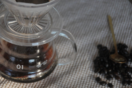Coffee maker with coffee beans on the table. Coffee preparationの写真素材