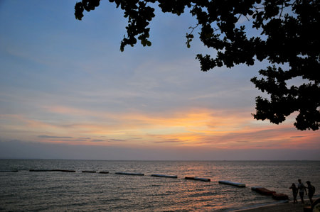 Sunset at the beach in the city of Pattaya, Thailandの写真素材
