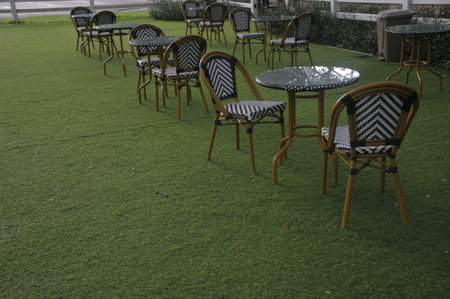 Tables and chairs in the garden, Thailand, South East Asiaの写真素材