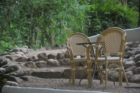 wicker chair and table in the garden,chiangmai Thailandの写真素材