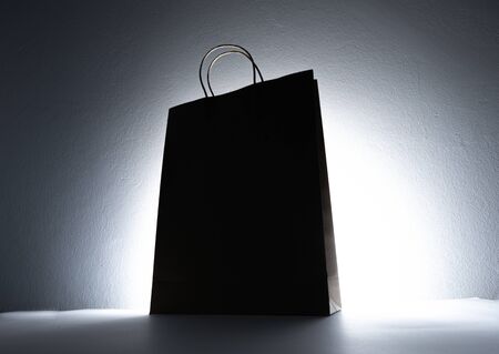 Paper shopping eco bag on bright dark background.の写真素材
