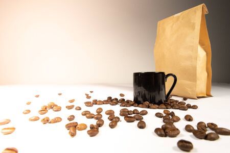Black coffee mugs, coffee beans and coffee bags. complete set of coffeeの写真素材