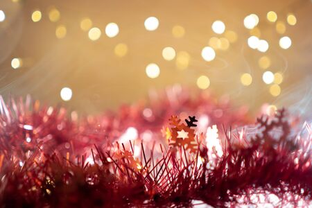 Christmas background have snowflake fir branches decorated with light bulbs.の写真素材
