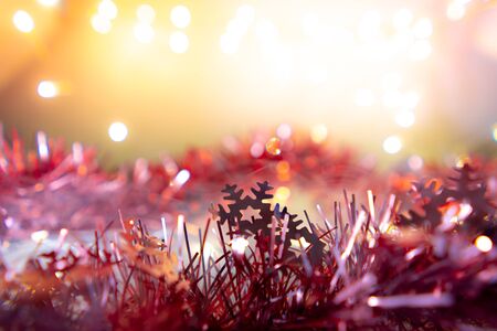 Christmas background have snowflake fir branches decorated with light bulbs.の写真素材