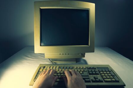 A man using an old personal computer. Ancient conceptの写真素材