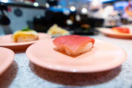 Tuna Sushi on a pink dish in a Japanese restauranの写真素材