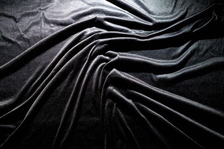 Black silk fabric background abstract Smooth and elegant background use with copy space, close-up and wallpaperの写真素材