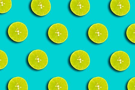 Half lemon pattern flat lay on a vivid blue backgroundの写真素材
