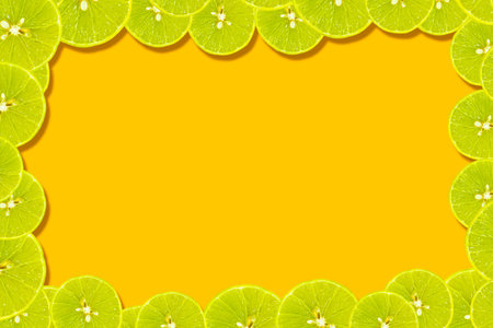 yellow lemon slices isolated on orange background. copy space