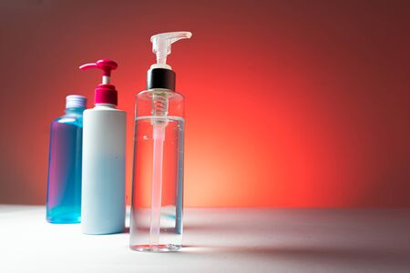 Alcohol gel In the pump bottle Used for sterilize In the red backgroundの写真素材