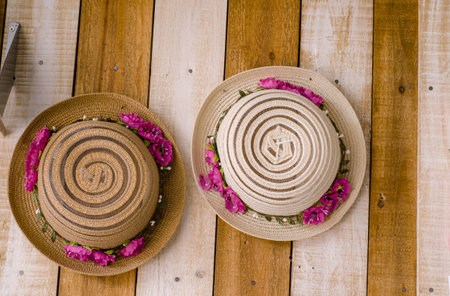 Straw hat on the wooden floorの写真素材