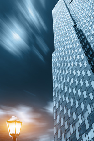 The high buildings and street lamps of the glass curtain wallのeditorial素材