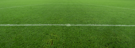 A neat football stadium built under night lightsの写真素材