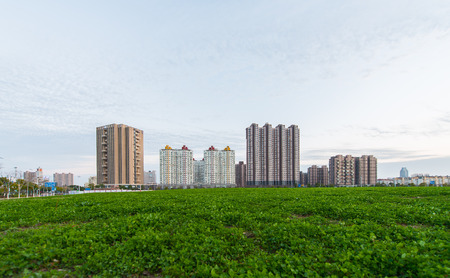 Urban buildings, roads and lawnsの写真素材
