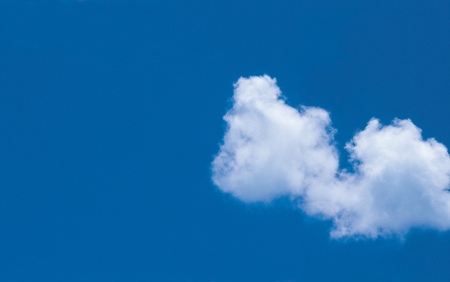 Cumulous clouds with deep blue sky の写真素材